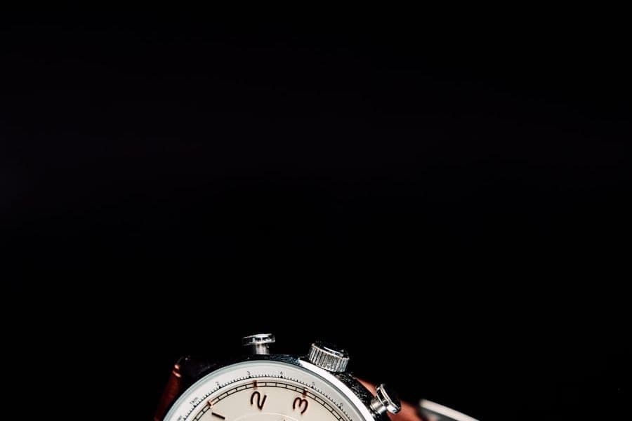 Vintage watch with a cream dial photographed against a dark background